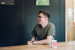 Mike laughs during a meeting in the shape studio